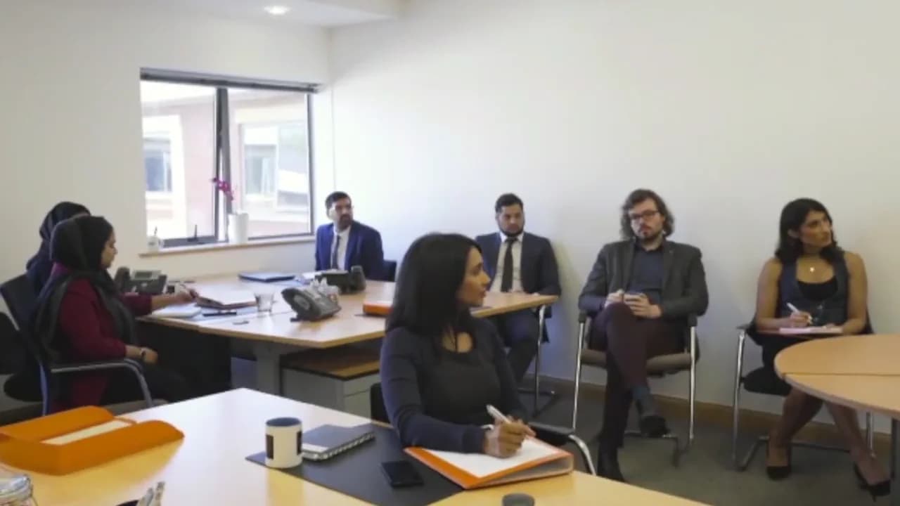 The MLC team in the meeting room at City View House